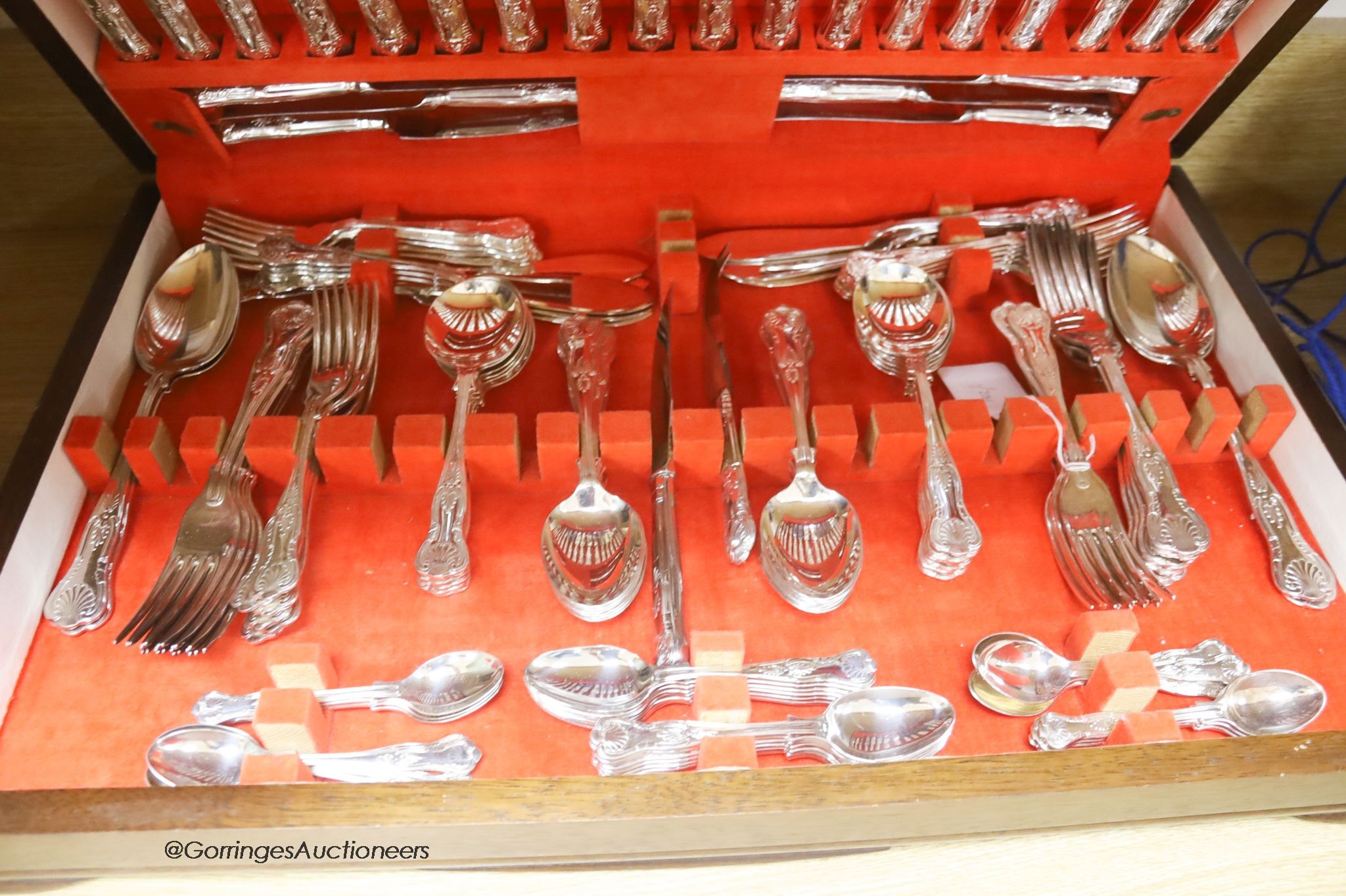 An oak cased Sheffield silver plated canteen of cutlery